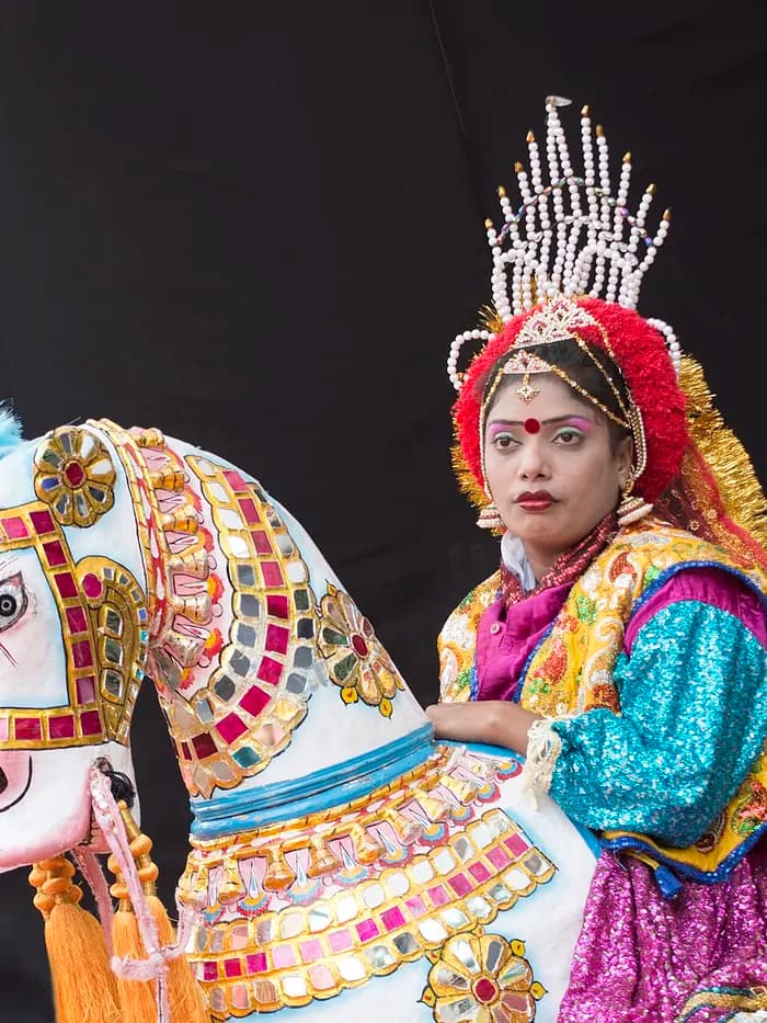 A Poikal Kudhirai folk dancer in a decorated horse frame