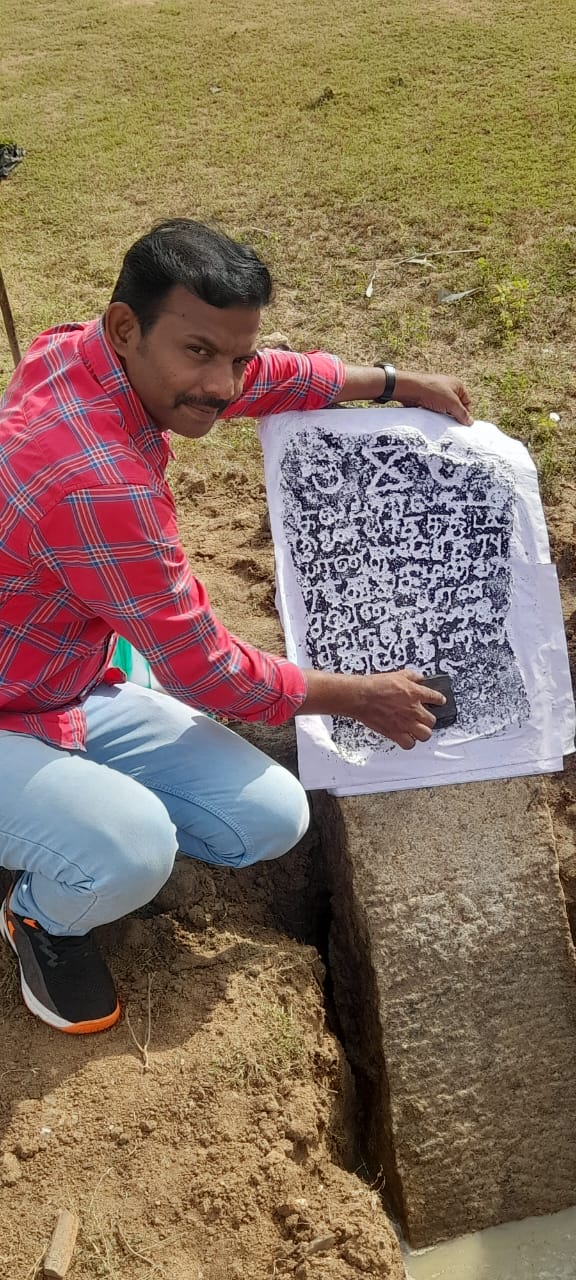 Dr. T. Balasubramanian reading an inscribed slab against its estampage